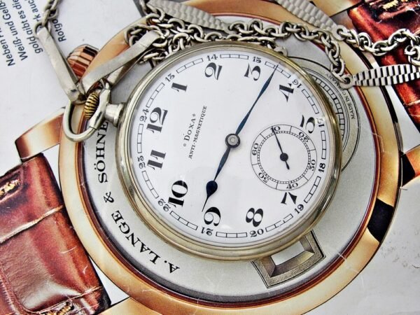 Nice Doxa pocket watch with porcelain dial with chain from the 1920s