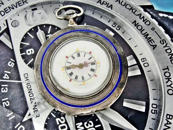 A nice silver pocket watch with a flower motif from the early 1900s.